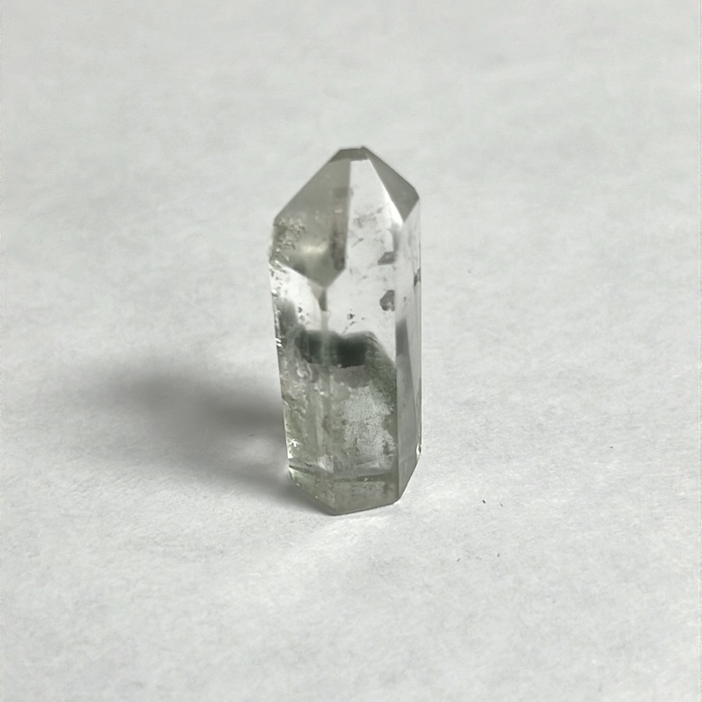 Quartz Crystal - 1.5 inches by half inch wide. Has small chip on tip.